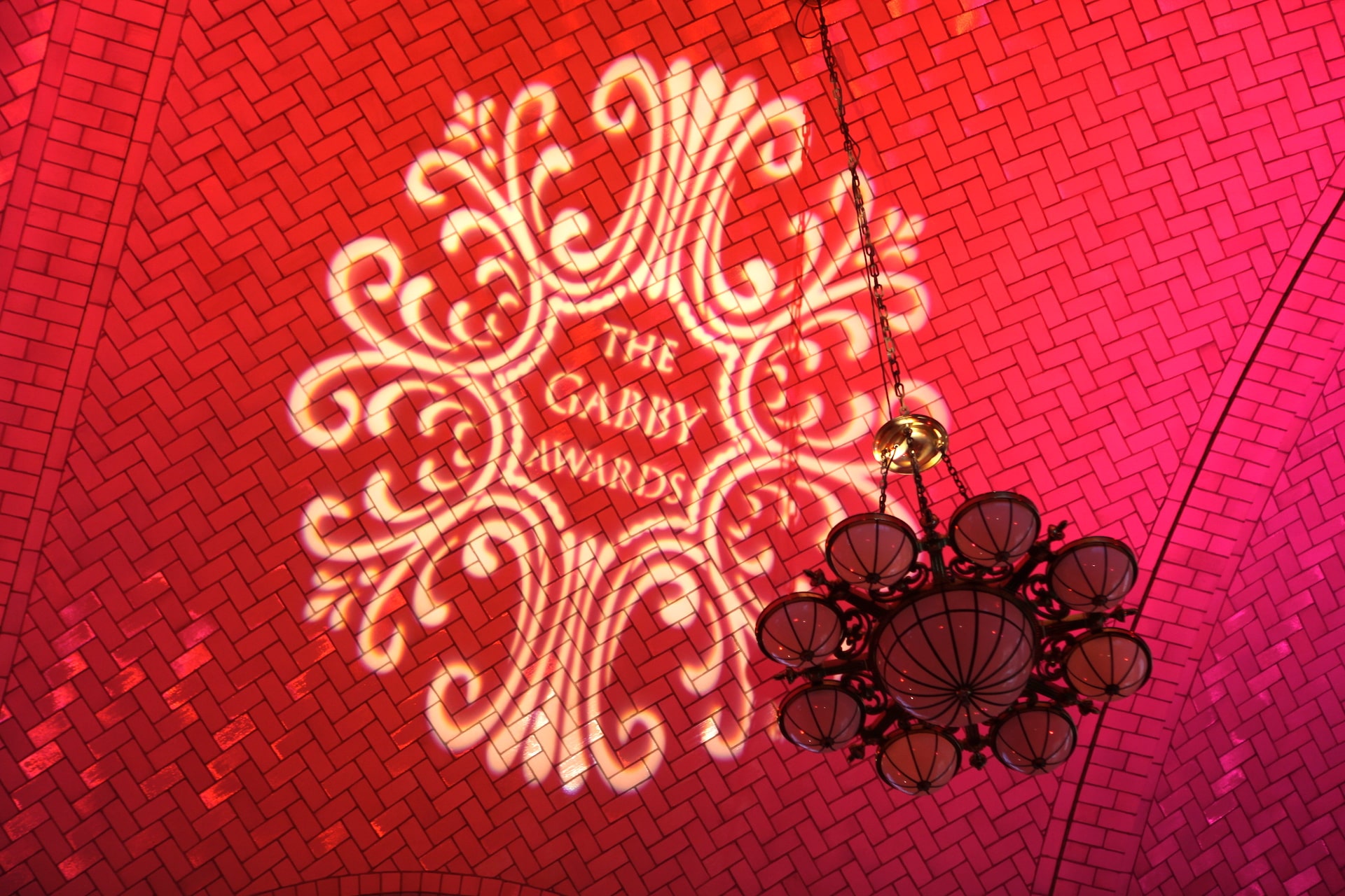 The Gabby Awards emblem projected inside Ellis Island's historic Registry Room in 2011