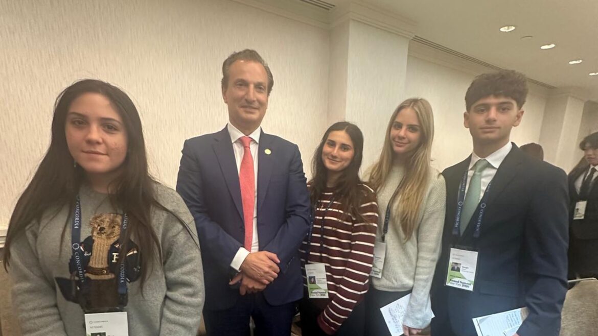 Gen G students gather with George Logothetis after the breakout session at the 2026 Concordia Annual Summit.