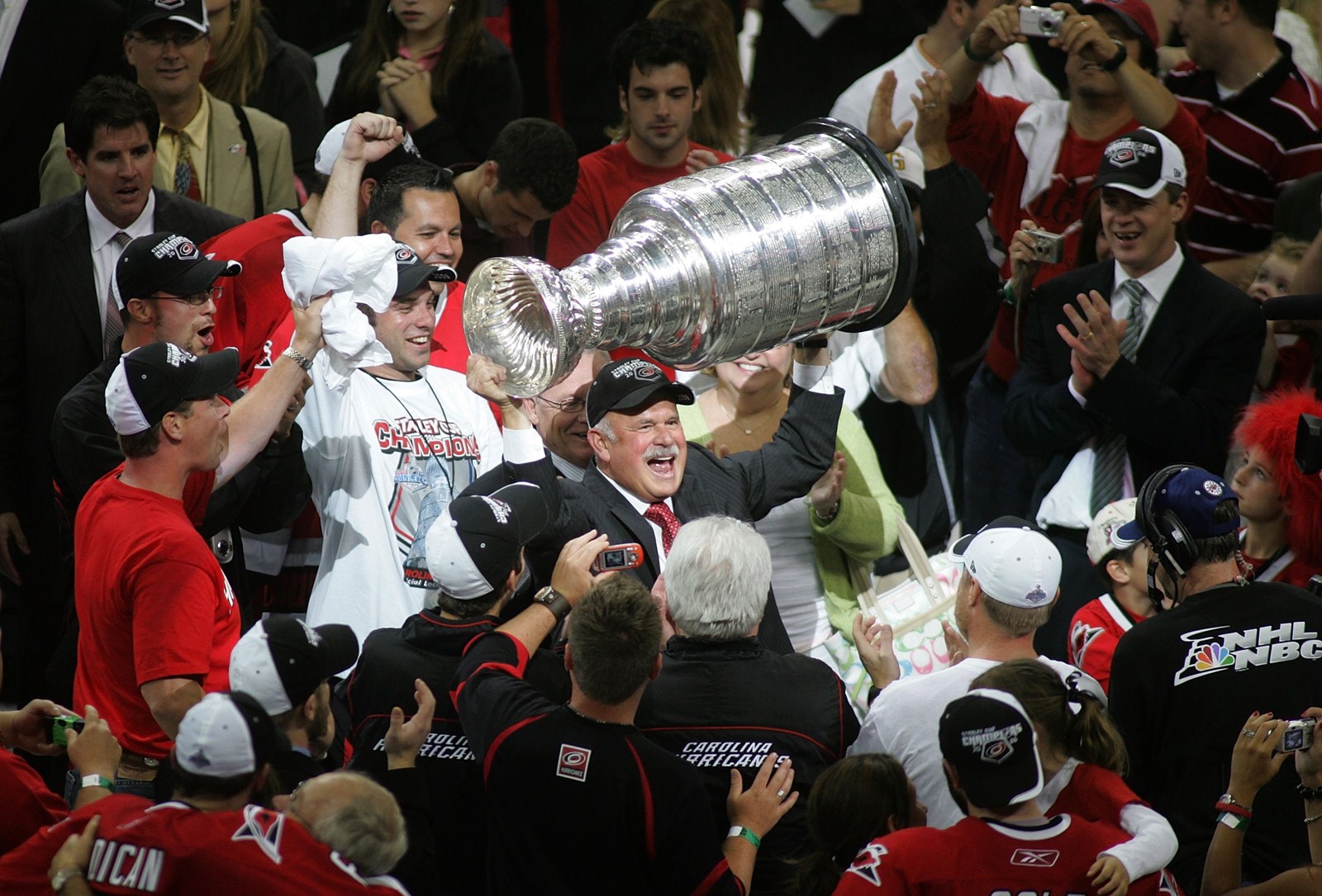 Pete Karmanos celebrating with the Stanley Cup