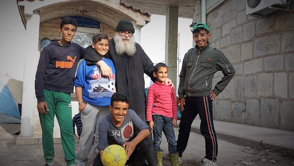 Elder Christodoulos with children supported by his monastery in northern Greece