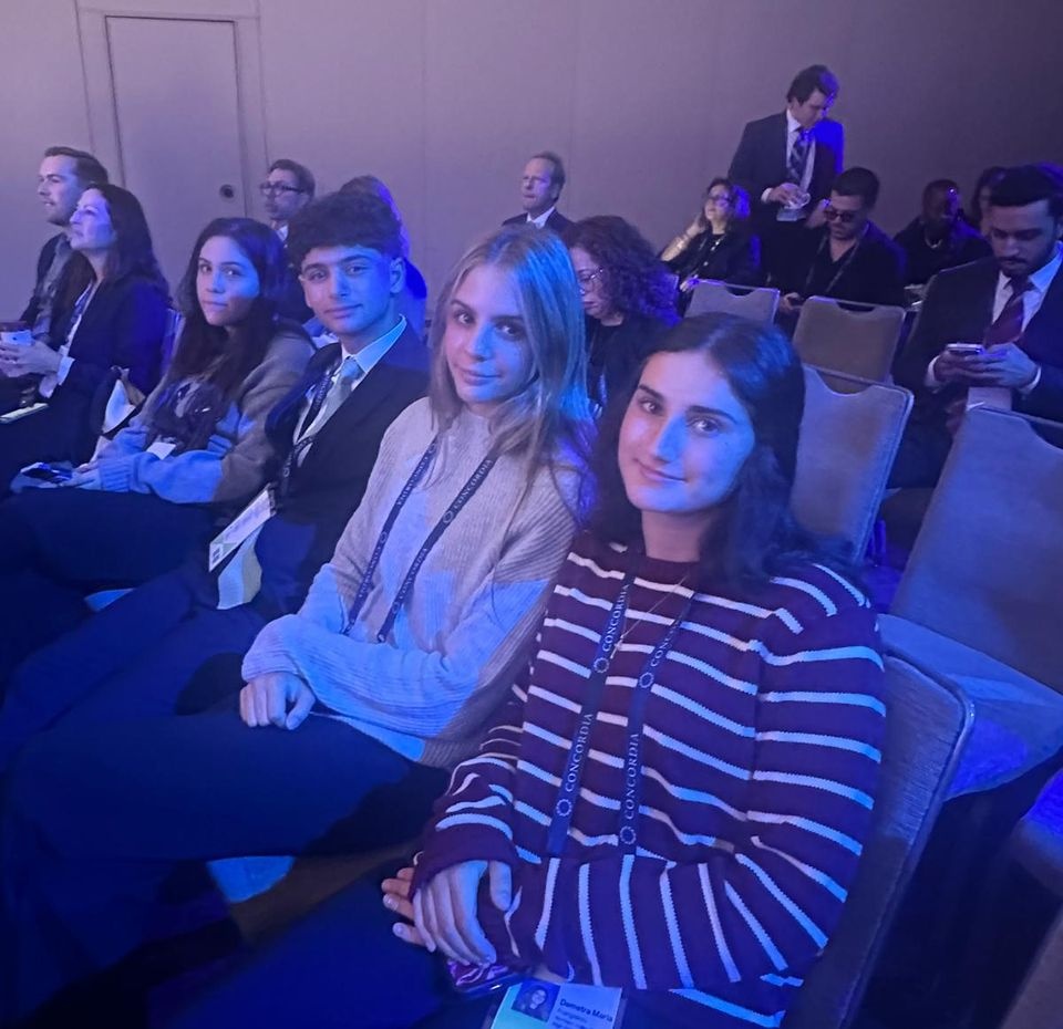 The four Gen G high school seniors seated together inside the Concordia Summit.