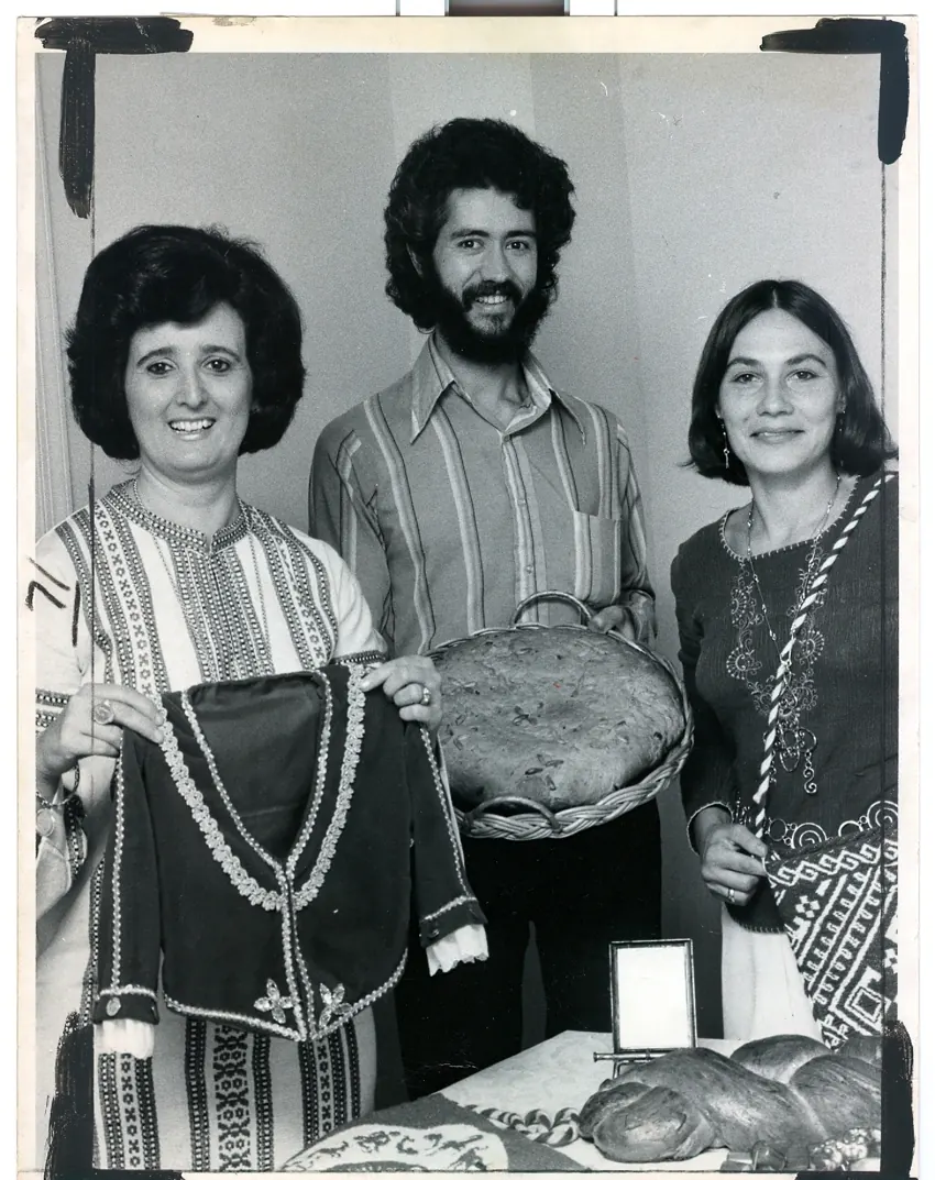 Three people sharing food and tradition