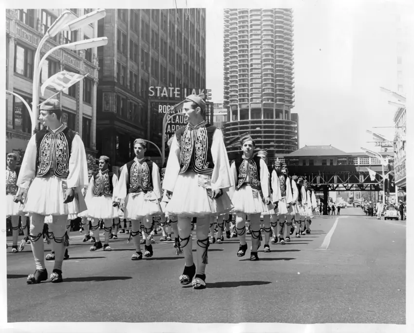 Evzones marching through a city street