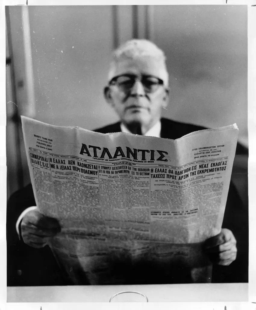 A man reading the Atlantis newspaper