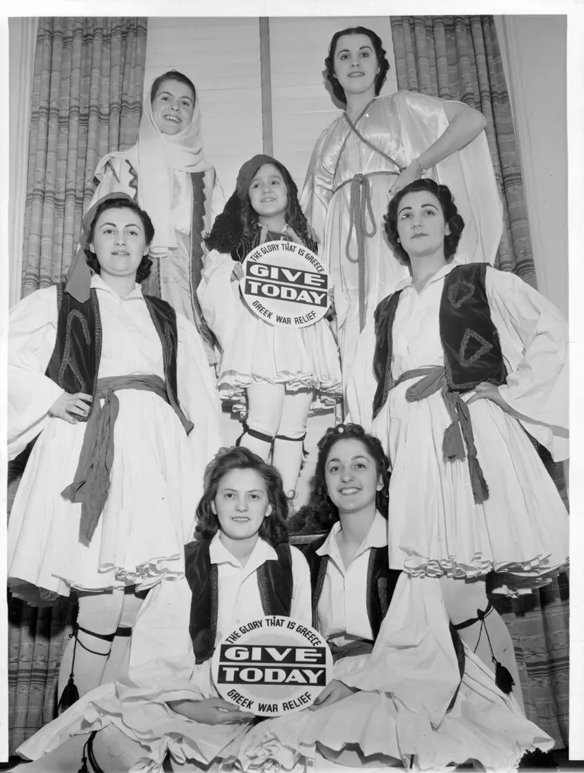 Young women in traditional dress gathered together