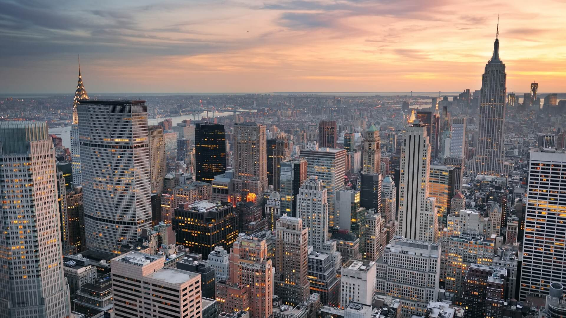 Manhattan skyline at sunset with the Empire State Building and Chrysler Building