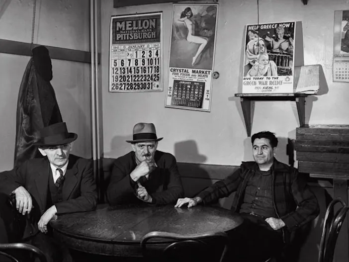 Men sharing a table in a coffeehouse